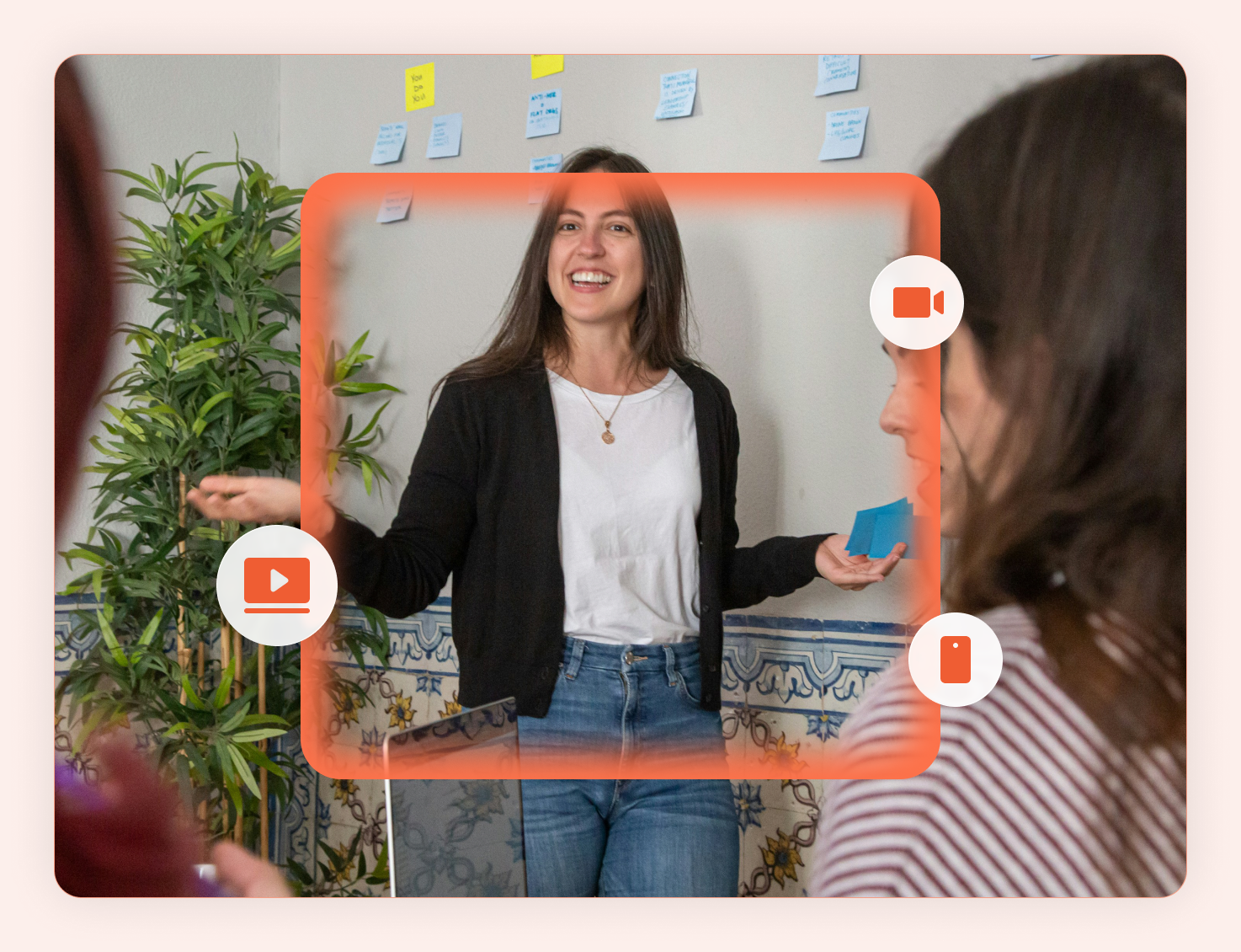 Woman teaching a group with a video call overlay showing camera and mobile icons