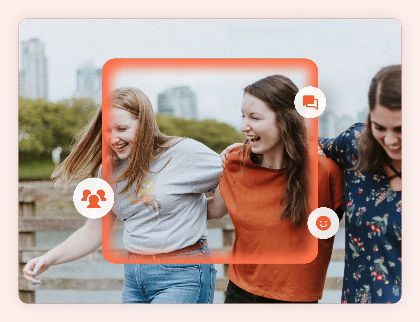Three women laughing together outdoors
